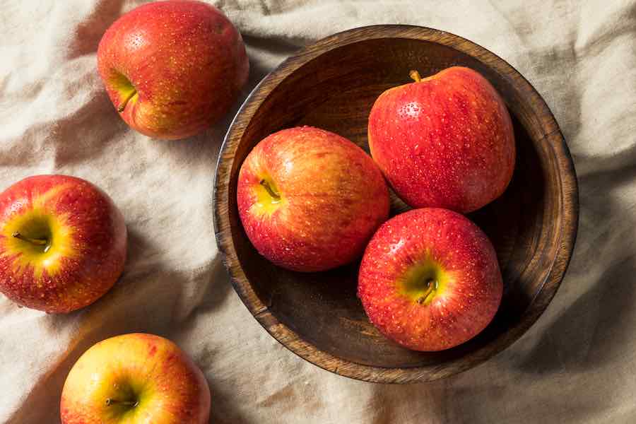 Premium Photo  Lots of tasty apples red organic envy apple new zealand top  view close up for wallpaper background