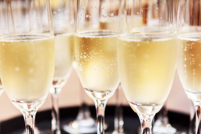 Closeup of flutes of champagne.